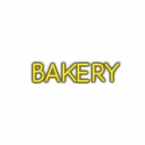 Neon bakery sign with yellow lettering on white background.