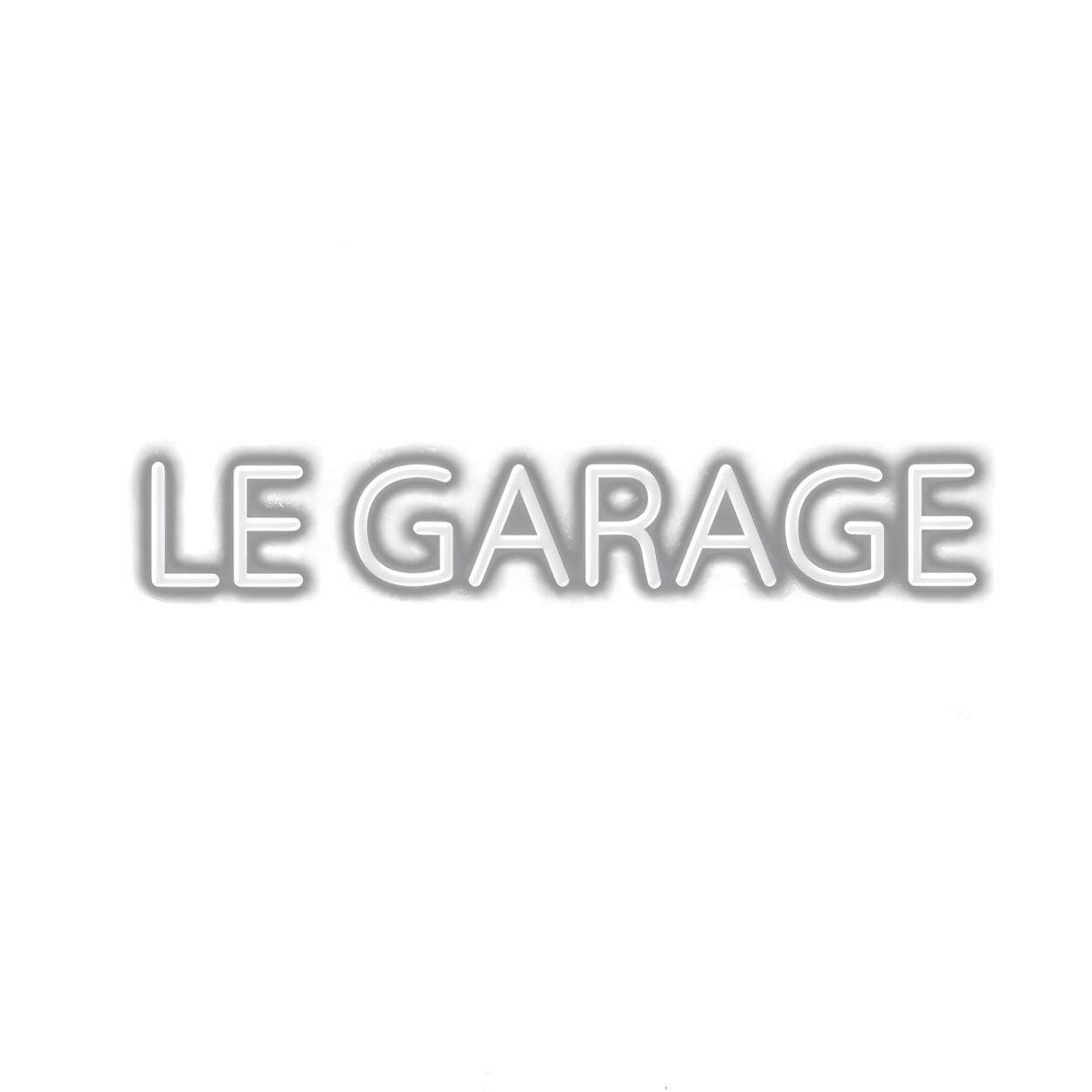 Embossed text 'LE GARAGE' on white background