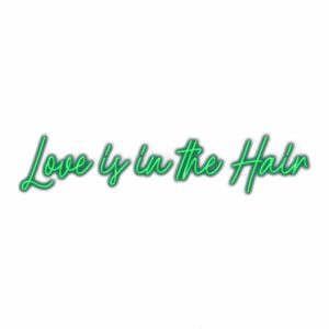 Neon sign saying "Love is in the Hair