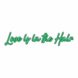 Neon sign saying "Love is in the Hair