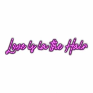 Neon sign saying "Love is in the Hair