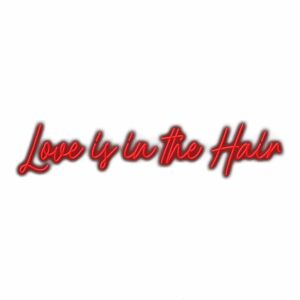 Red cursive text "Love is in the Hair" slogan.