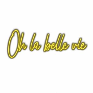 Neon sign text "Oh la belle vie" in cursive.