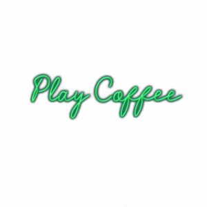 Neon green "Play Coffee" sign with cursive font.