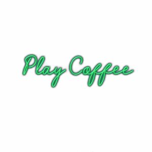 Neon "Play Coffee" sign in cursive green lettering.