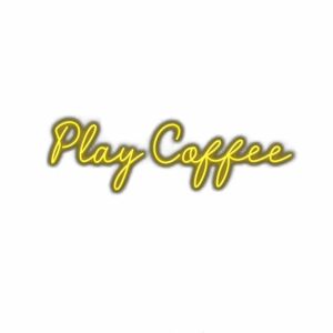 Neon sign text "Play Coffee" with yellow glow.