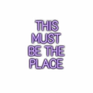Text "This Must Be The Place" in purple 3D font.
