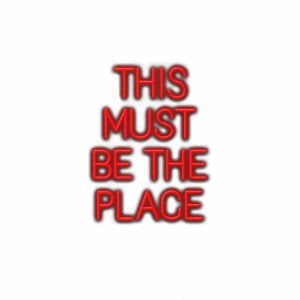 Red neon sign text "This Must Be The Place