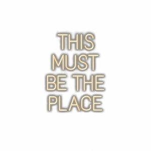 Inspirational quote "This Must Be The Place" in stylized font.