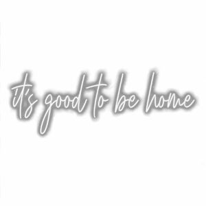 Cursive text "It's good to be home" wall art.